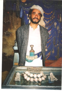 A jewellery maker in the old San'a market wearing his jambiya