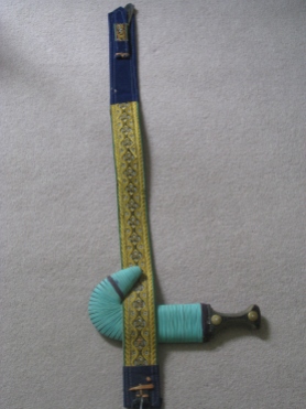 Jambiya and the embroidered belt.
